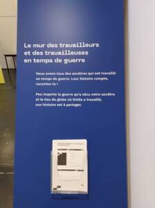 Photographie du mur des travailleurs et travailleuses en temps de guerre, 2023.
